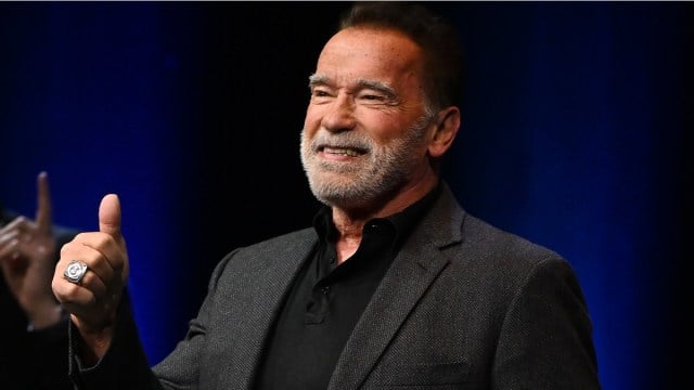 LONDON, ENGLAND - OCTOBER 24: EXCLUSIVE COVERAGE Arnold Schwarzenegger arrives onstage at an Evening with Arnold Schwarzenegger presented by Fane at London Palladium on October 24, 2023 in London, England.