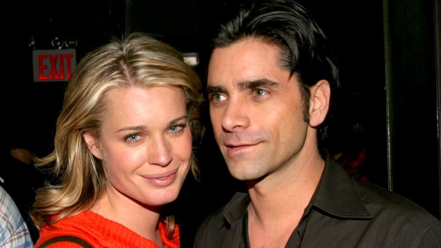 Rebecca Romijn and John Stamos pose for a photo together