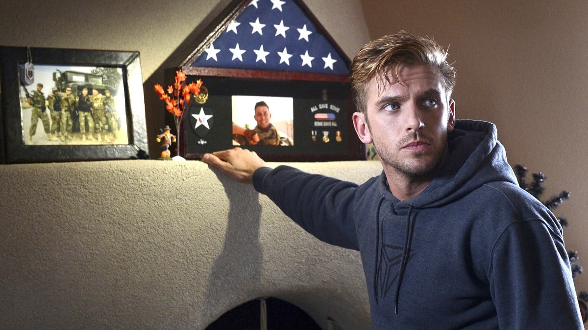 Dan Stevens as former soldier David Collins leans on a mantelpiece in 'The Guest.' 