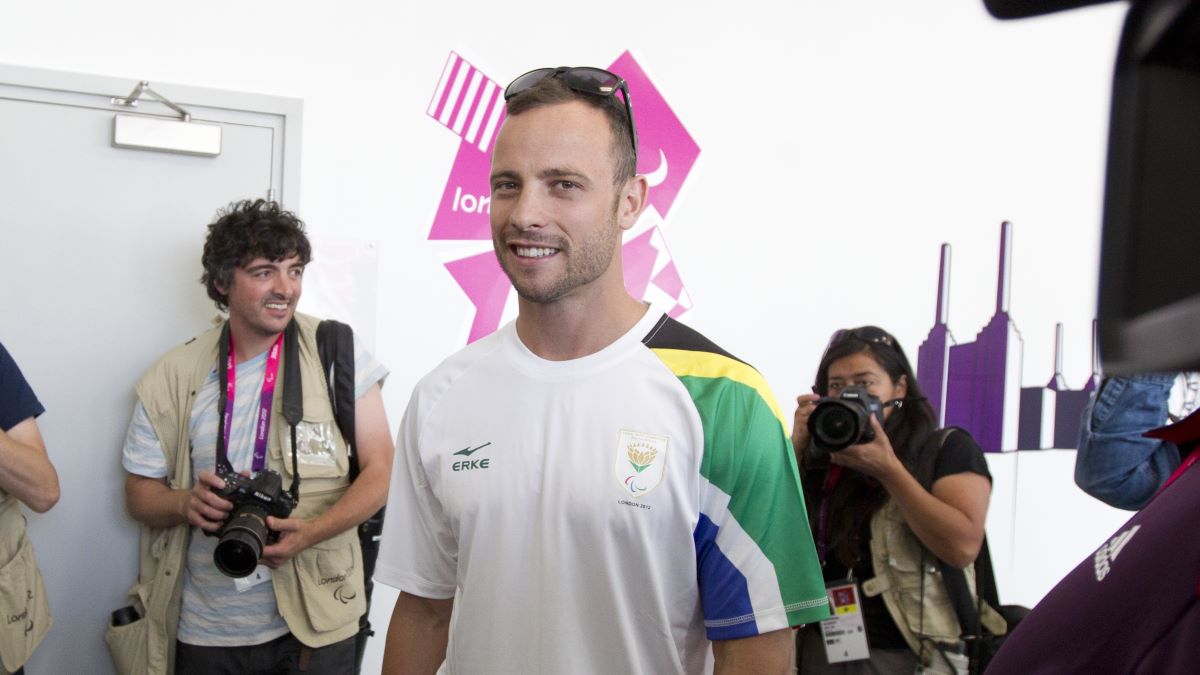 Oscar Pistorius, answers questions from world media during a press conference Tuesday prior to the 2012 Paralympic Games opening. Pistorius, who competes on two prosthetic legs, will run the 100, 200 and 400 meters and is favored to win the longer races. (Photo by Robert Daemmrich Photography Inc/Corbis via Getty Images)