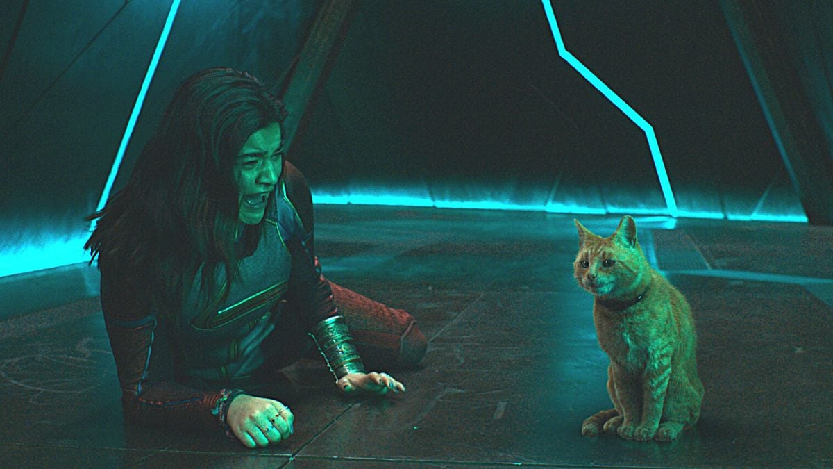 Iman Vellani as Kamala Khan screaming in fear at the sight of Goose the Flerken cat in Marvel Studios' 'The Marvels'.