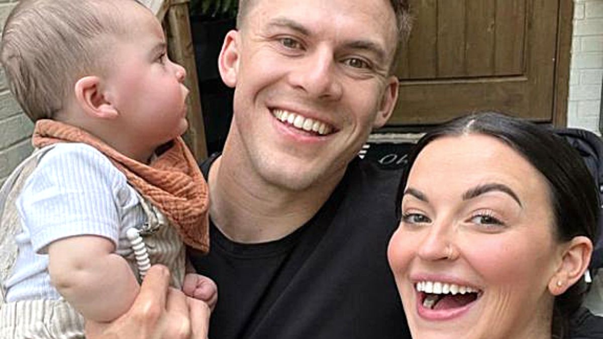 Tia Booth, Taylor Mock and son Tatum looking smiley.