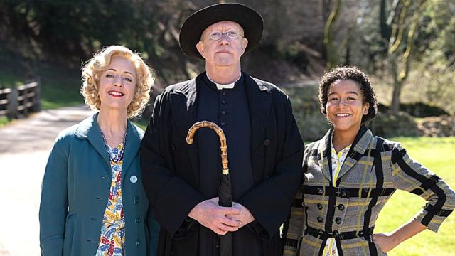Claudie Blakley as Mrs. Devine, Mark Williams as Father Brown, and Ruby-May Martinwood as Brenda Palmer in 'Father Brown' Season 11