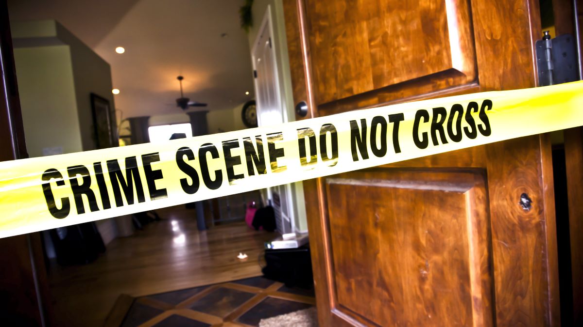 Crime Scene tape at the front door of a luxury home