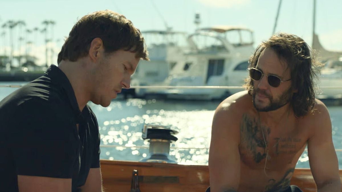 Chris Pratt as James Reece and Taylor Kitsch as Ben Edwards talk on a boat in The Terminal List