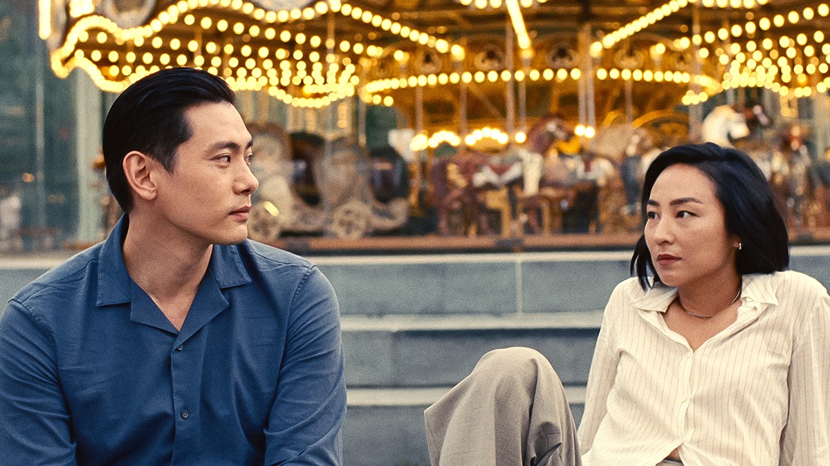 Teo Yoo as Hae Sung and Greta Lee as Nora Moon looking at each other in 'Past Lives'.