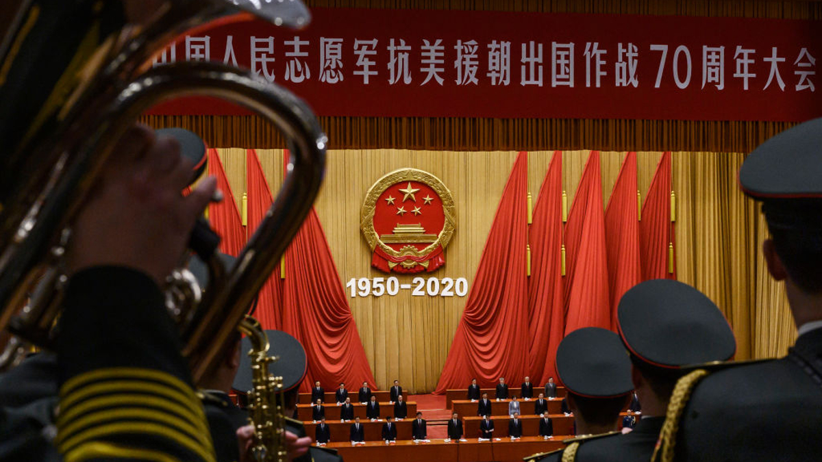 Chinese President Xi Jinping, middle, and senior members of the government stand as a the People's Liberation Army Band plays the national anthem at a ceremony marking the 70th anniversary of China's entry into the Korean War, on October 23, 2020 at the Great Hall of the People in Beijing, China. 