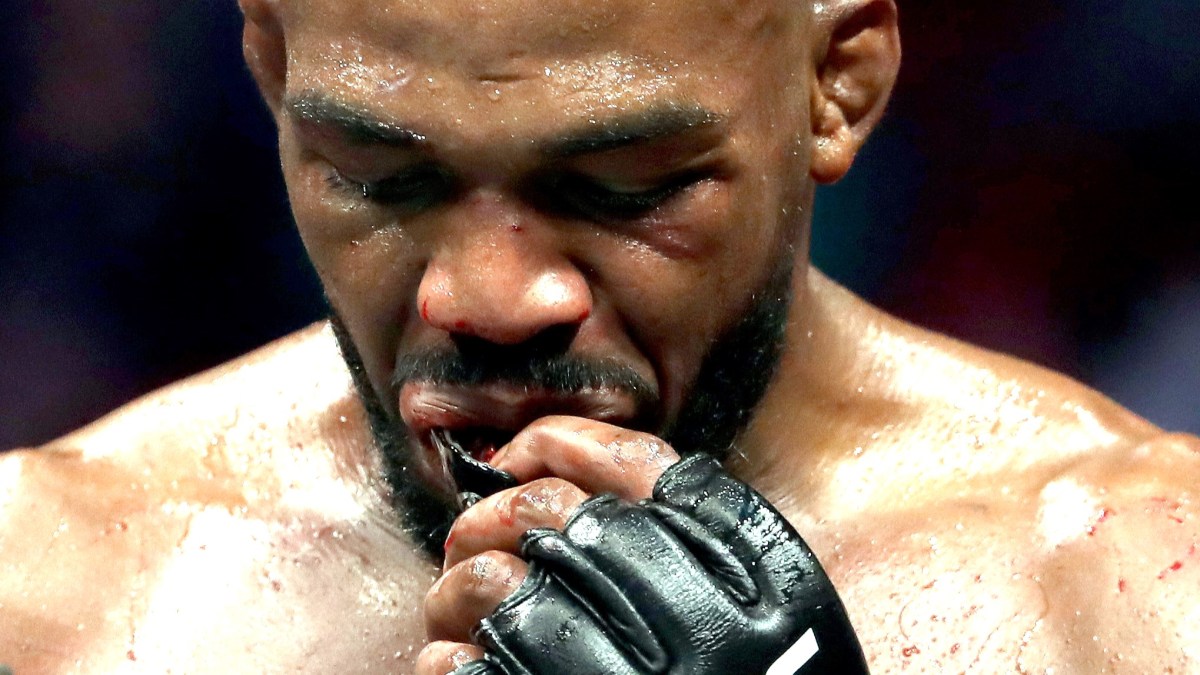 Jon Jones walks to his corner in between rounds against Dominick Reyes in their UFC Light Heavyweight Championship bout during UFC 247 at Toyota Center on February 08, 2020 in Houston, Texas. (Photo by Ronald Martinez/Getty Images)