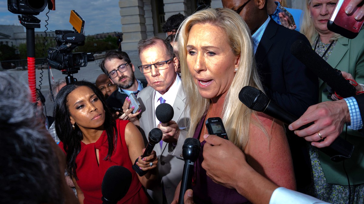 Rep. Marjorie Taylor Greene (R-GA) gaggles with reporters on the steps of the House of Representatives at the U.S. Capitol on April 18, 2024 in Washington, DC. Speaker Mike Johnson (R-LA) is pushing aid to Ukraine, Israel and Taiwan through the House over the objections of the right-flank of his own party.