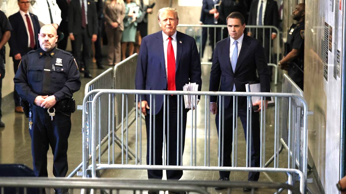 Former U.S. President Donald Trump speaks to the media alongside his attorney Todd Blanche (R) outside the courtroom during his trial for allegedly covering up hush money payments at Manhattan Criminal Court on April 23, 2024 in New York City. Former U.S. President Donald Trump faces 34 felony counts of falsifying business records in the first of his criminal cases to go to trial. (Photo by Brendan McDermid-Pool/Getty Images)