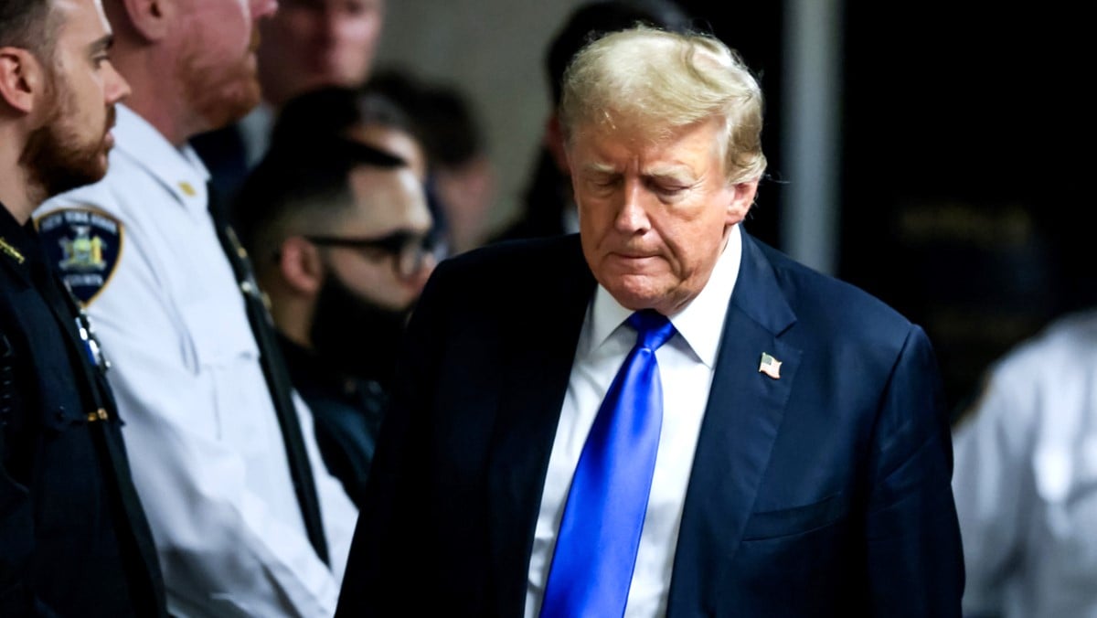 Former U.S. President Donald Trump departs the courtroom after being found guilty on all 34 counts in his hush money trial at Manhattan Criminal Court on May 30, 2024 in New York City. The former president was found guilty on all 34 felony counts of falsifying business records in the first of his criminal cases to go to trial. Trump has now become the first former U.S. president to be convicted of felony crimes.