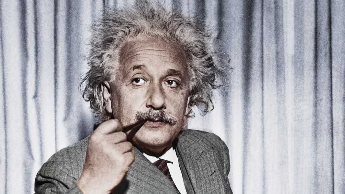 Professor Albert Einstein, now exiled from Germany, calmly smokes his pipe. He is in the United States to give a series of lectures to advanced students at Princeton University.