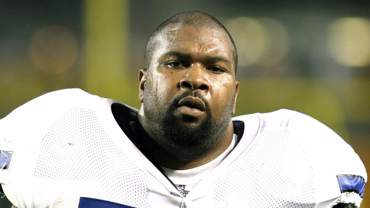 Offensive lineman Larry Allen #73 of the Dallas Cowboys looks on from the sideline during a preseason game against the Pittsburgh Steelers at Heinz Field on August 21, 2003 in Pittsburgh, Pennsylvania. The Steelers defeated the Cowboys 15-14.