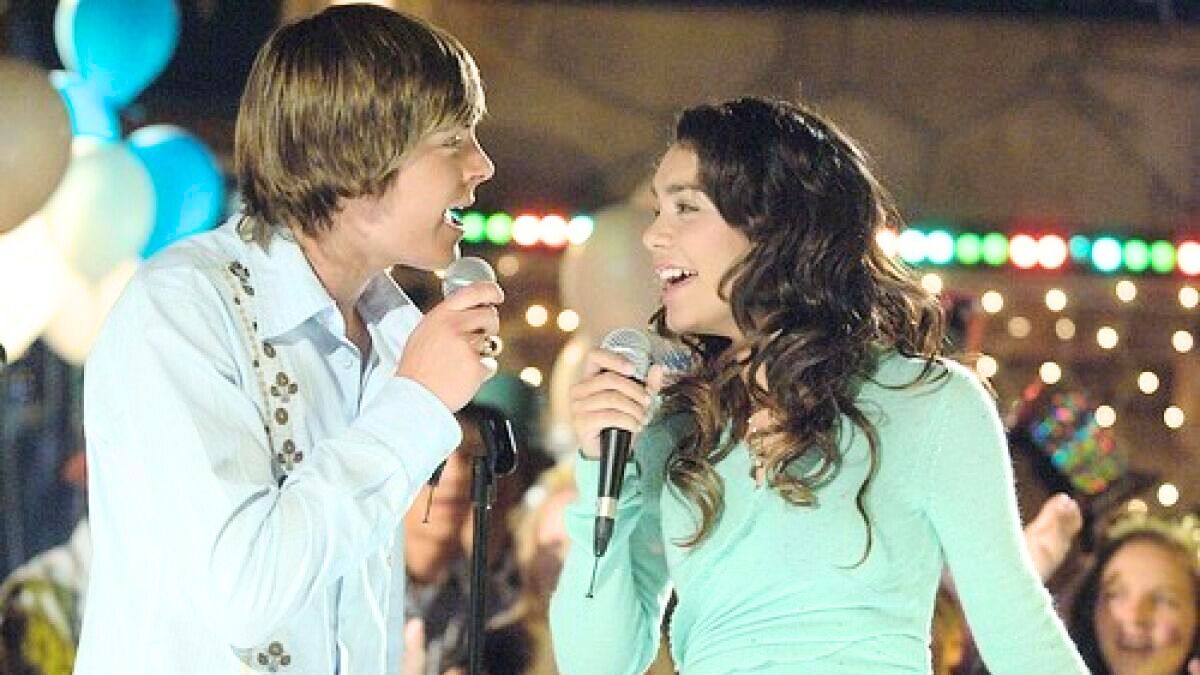 Zac Efron and Vanessa Hudgens as Troy and Gabriella in High School Musical