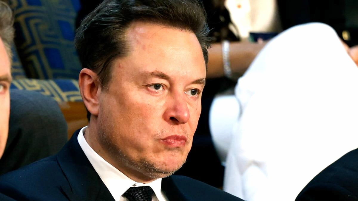 Tesla CEO Elon Musk (C) listens as Israeli Prime Minister Benjamin Netanyahu addresses a joint meeting of Congress in the chamber of the House of Representatives at the U.S. Capitol on July 24, 2024 in Washington, DC. Netanyahu’s visit occurs as the Israel-Hamas war reaches nearly ten months. A handful of Senate and House Democrats boycotted the remarks over Israel’s treatment of Palestine.