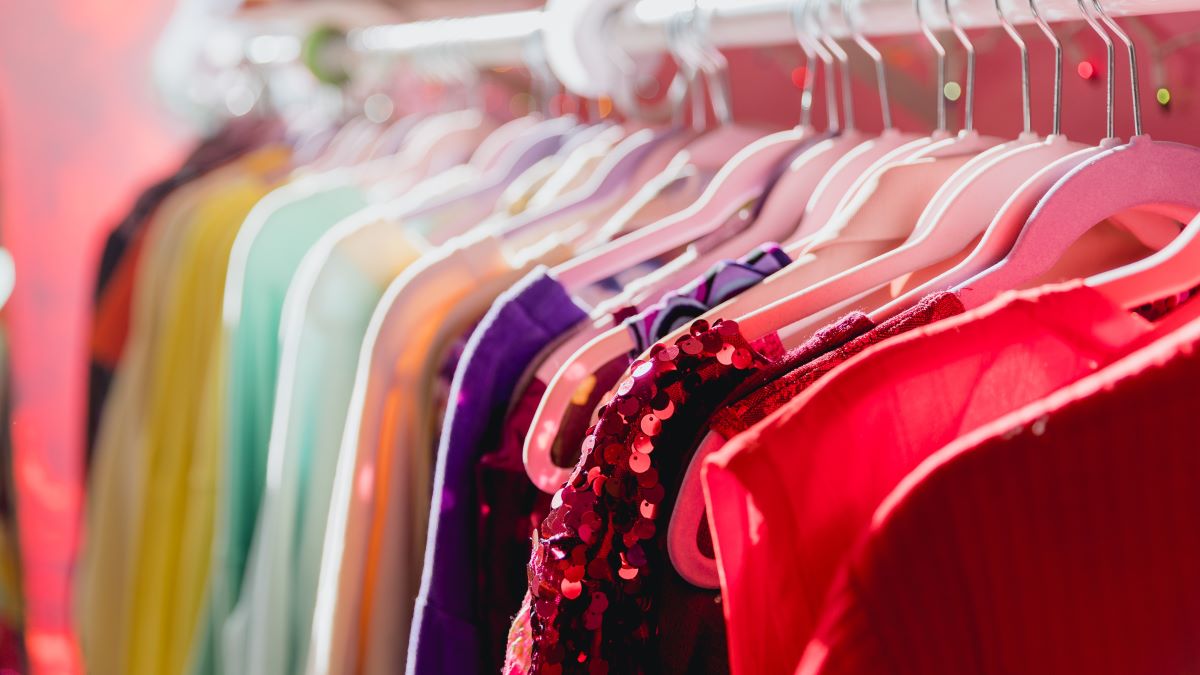 Colorful fashionable Vibrant Clothing Rack at a Thrift Store in Portland Oregon. Clothing is vintage and has been recycled and made stylish again.