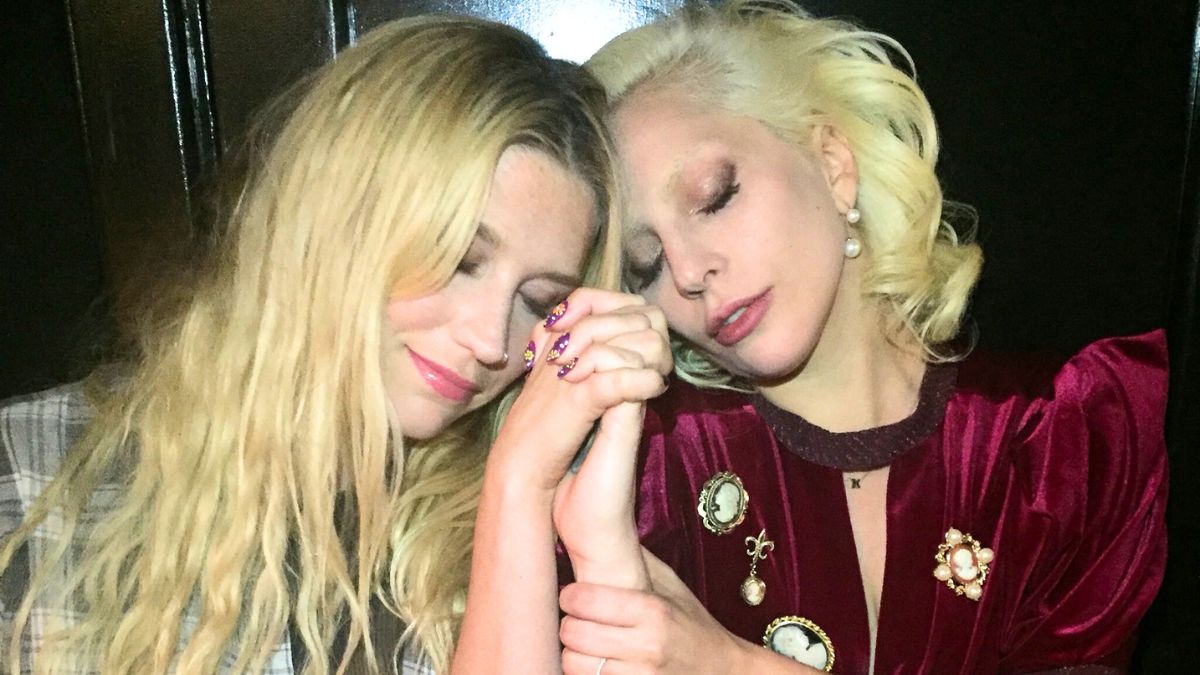 Lady Gaga holding hands with Kesha