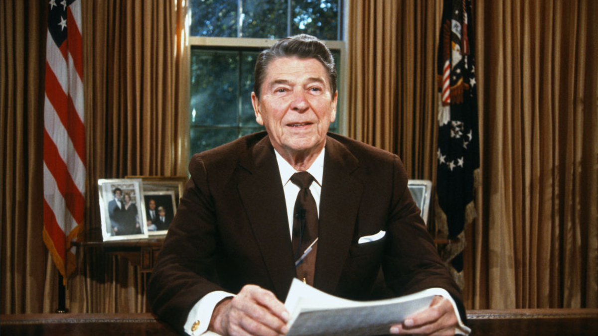 US President Ronald Reagan (1911 - 2004) sits behind his desk in the White House's Oval Office, Washington DC, October 14, 1987. He had just delivered an address to the nation concerning the nomination of Judge Robert Bork as an Associate Justice of the United States Supreme Court. 