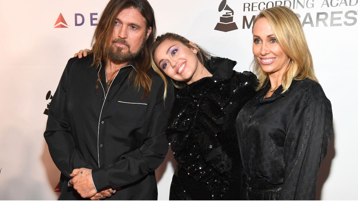 LOS ANGELES, CA - FEBRUARY 08: (L-R) Billy Ray Cyrus, Miley Cyrus, and Tish Cyrus attend MusiCares Person of the Year honoring Dolly Parton at Los Angeles Convention Center on February 8, 2019 in Los Angeles, California. (Photo by Kevin Mazur/Getty Images for The Recording Academy)