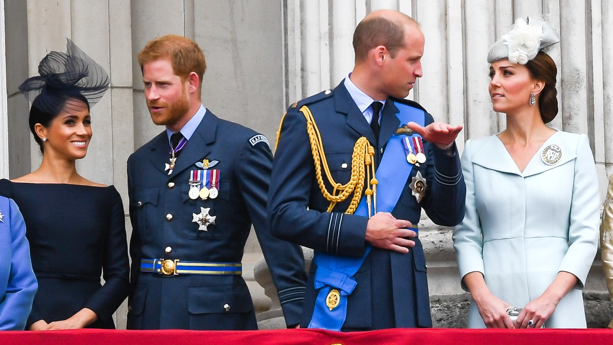 Meghan, Duchess of Sussex, Prince Harry, Duke of Sussex, Prince William, Duke of Cambridge and Catherine, Duchess of Cambridge stand on the balcony of Buckingham Palace to view a flypast to mark the centenary of the Royal Air Force (RAF) on July 10, 2018 in London, England.