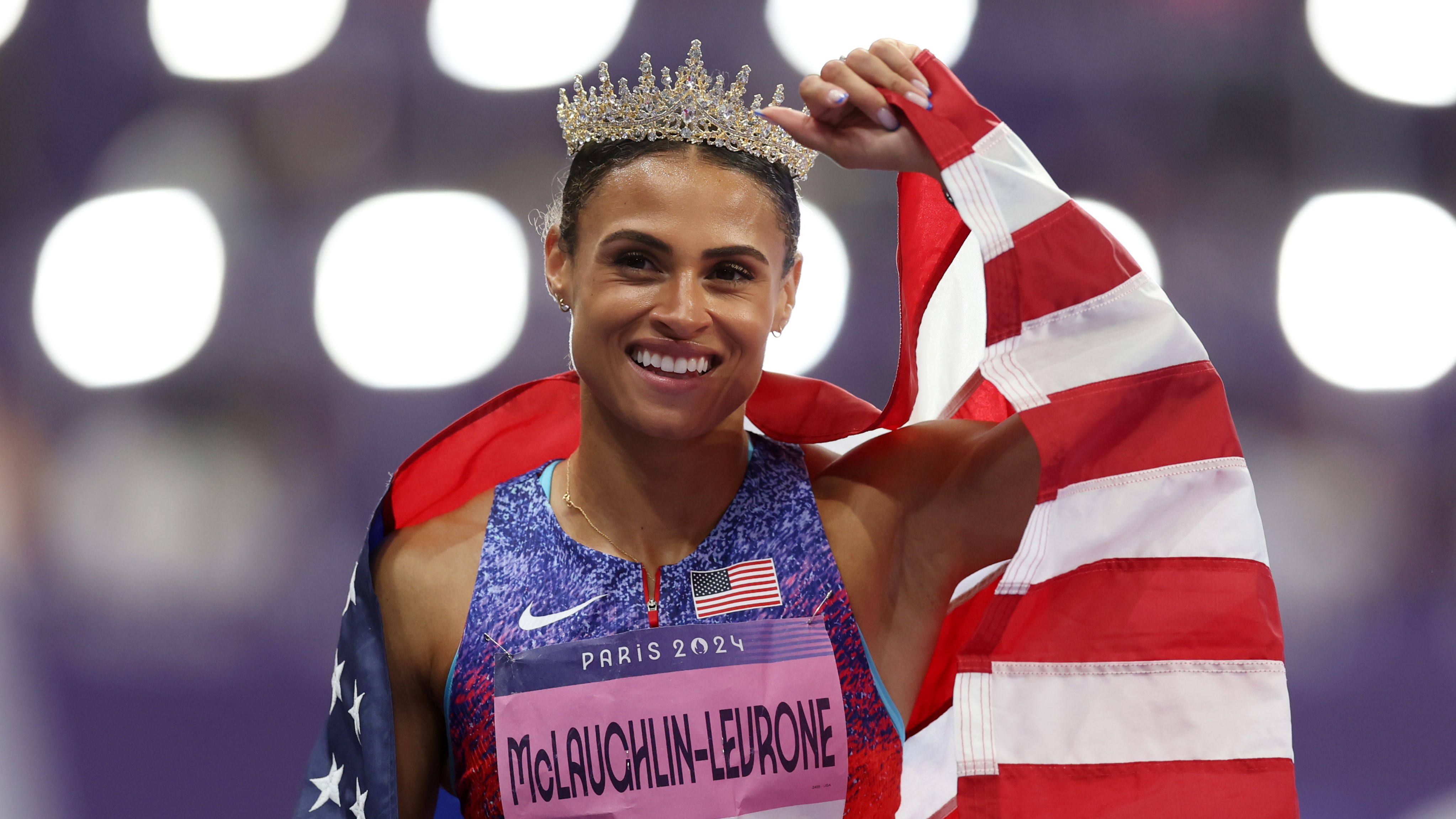 Sydney McLaughlin-Levrone of Team United States celebrates winning the gold medal with the new World Record by wearing a crown after competing in the Women's 400m Hurdles Final on day thirteen of the Olympic Games Paris 2024 at Stade de France on August 08, 2024 in Paris, France. (Photo by Julian Finney/Getty Images)