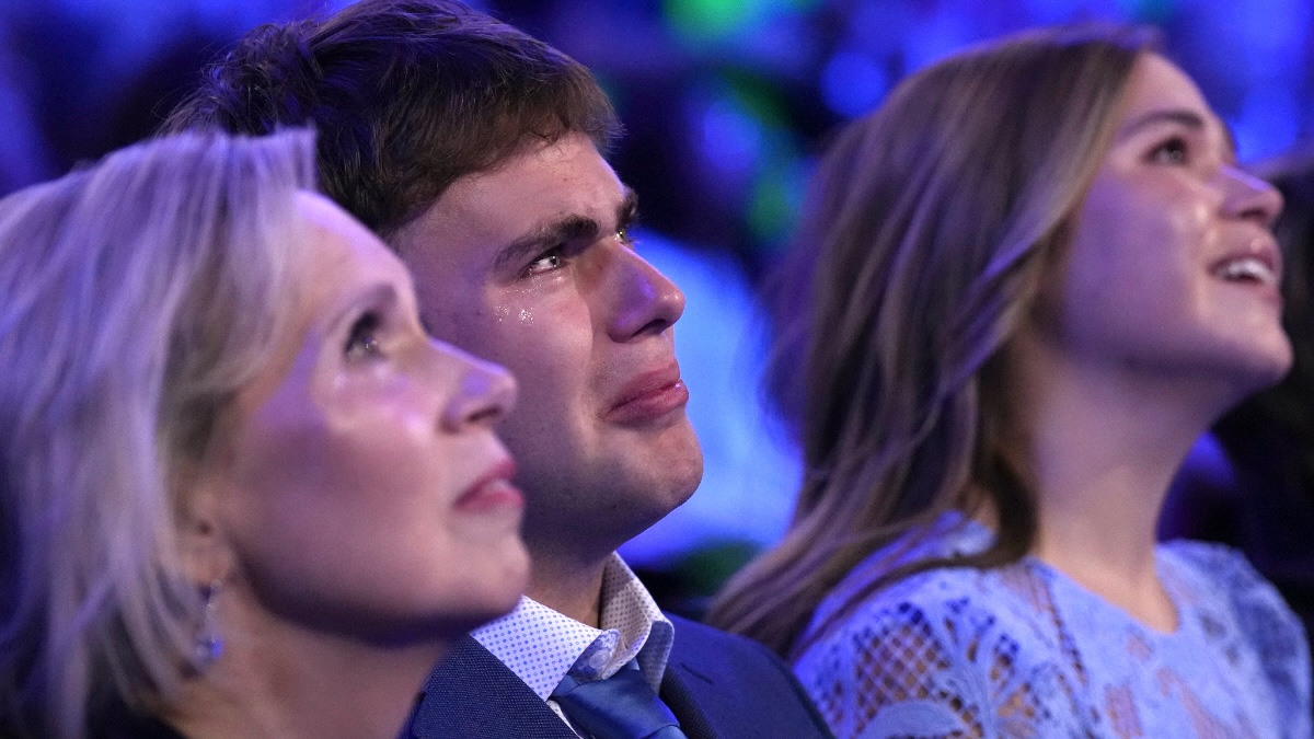 (L-R) Minnesota first lady Gwen Walz and her children Gus Walz and Hope Walz look on during the third day of the Democratic National Convention