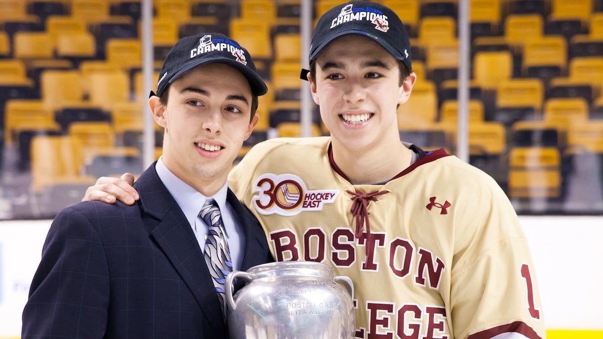 Brothers Johnny Gaudreau #13 and Matthew Gaudreau #21 of the Boston College Eagles celebrate after the Eagles beat the Northeastern University Huskies