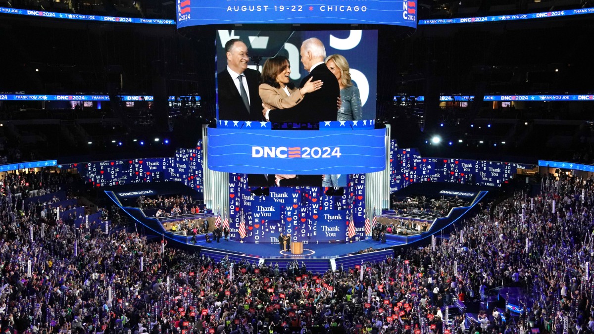 Kamala Harris greet U.S. President Joe Biden as First Lady Jill Biden and Second Gentleman Doug Emhoff look on at the end of the first day of the Democratic National Convention