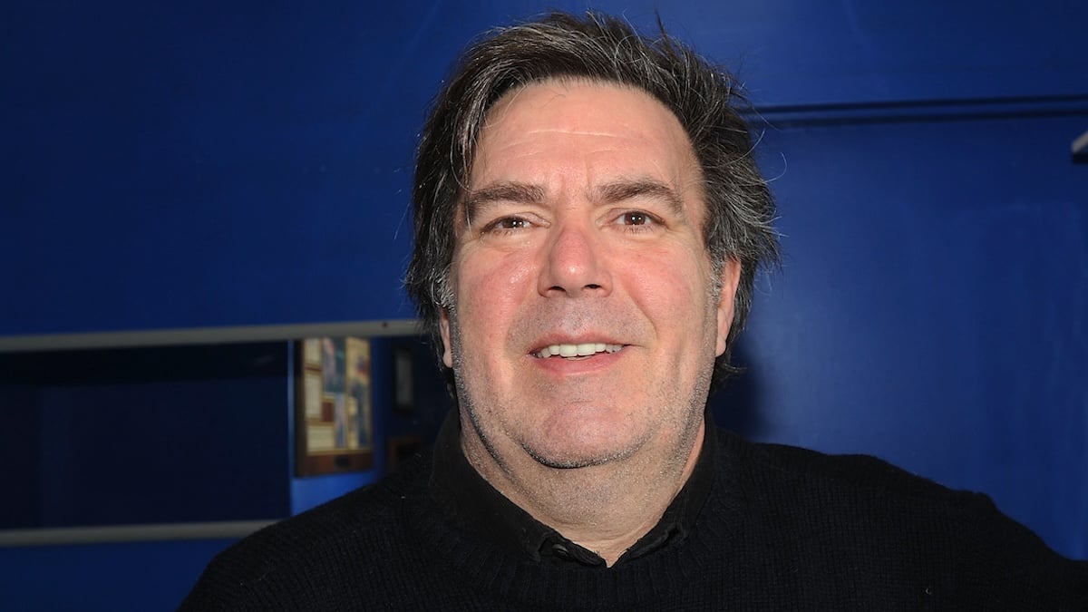 Kevin Meaney, dressed in black, backstage at The Stress Factory Comedy Club