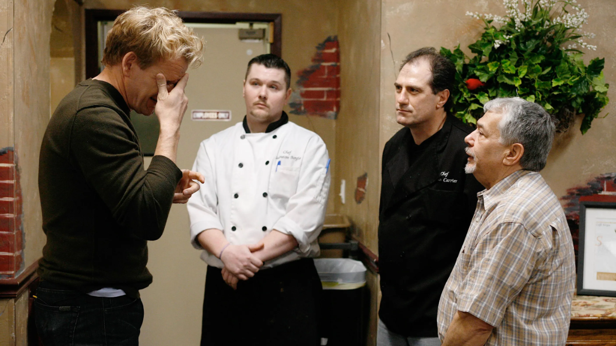 A frustrated Gordon Ramsay talks with restaurant staff on Kitchen Nightmares