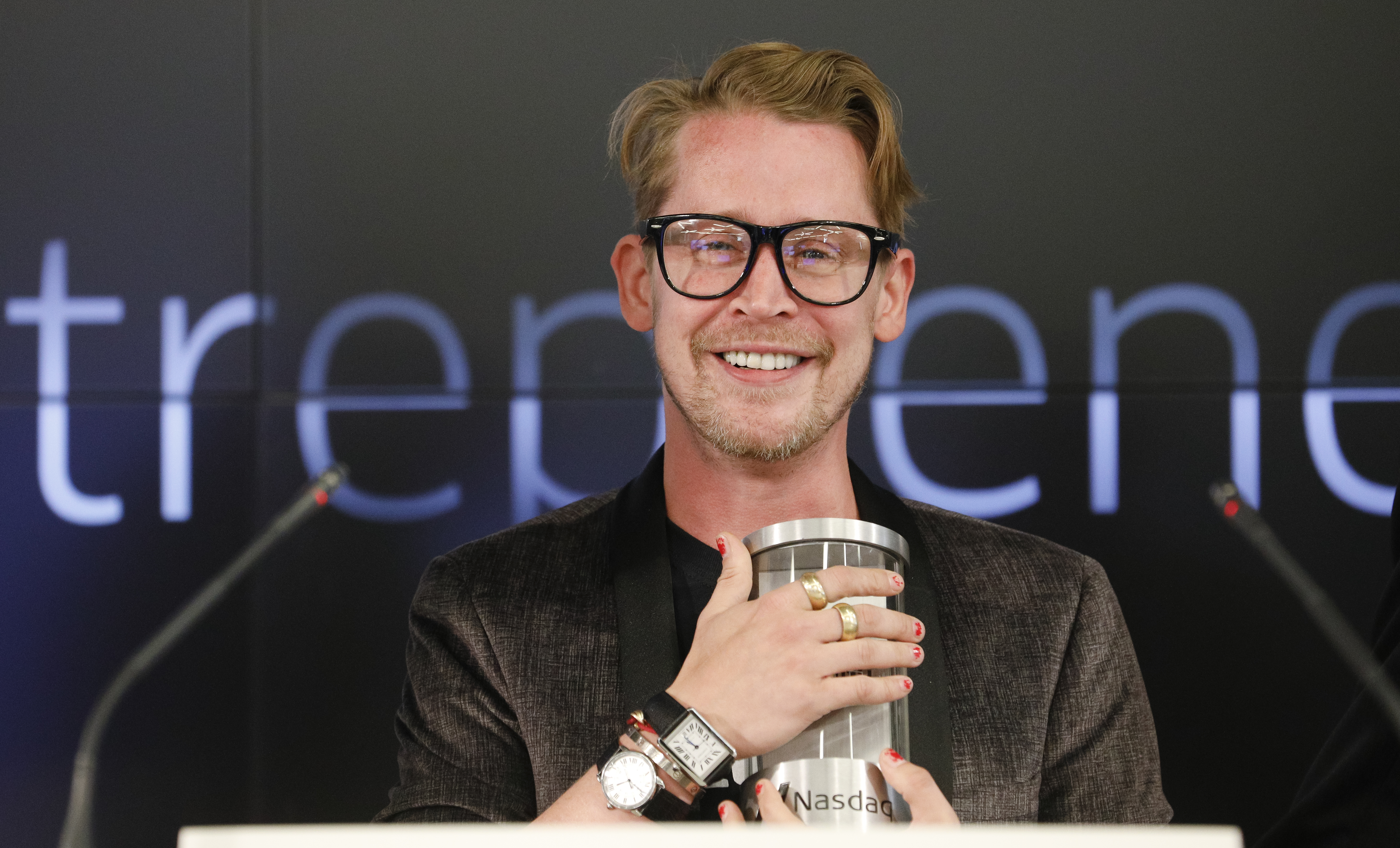 SAN FRANCISCO, CA - AUGUST 06: Macaulay Culkin, co-founder of lifestyle media Bunny Ears, is the honorary bell ringers of the Nasdaq Closing Bell from the Nasdaq Entrepreneurial Center on August 6, 2019 in San Francisco, California. They were joined by the graduating class of the Lehigh Startup Academy and Jeff Thomas of Nasdaq (Back L) (Photo by Kimberly White/Getty Images for Nasdaq Entrepreneurial Center) Macaulay Culkin and Stewart Miller, co-founders of Lifestyle Media Bell Ringers of the Nasdaq Closing Bell from the Nasdaq Entrepreneurial Center in San Francisco, joined by the Graduating Class of the Lehigh Startup Academy