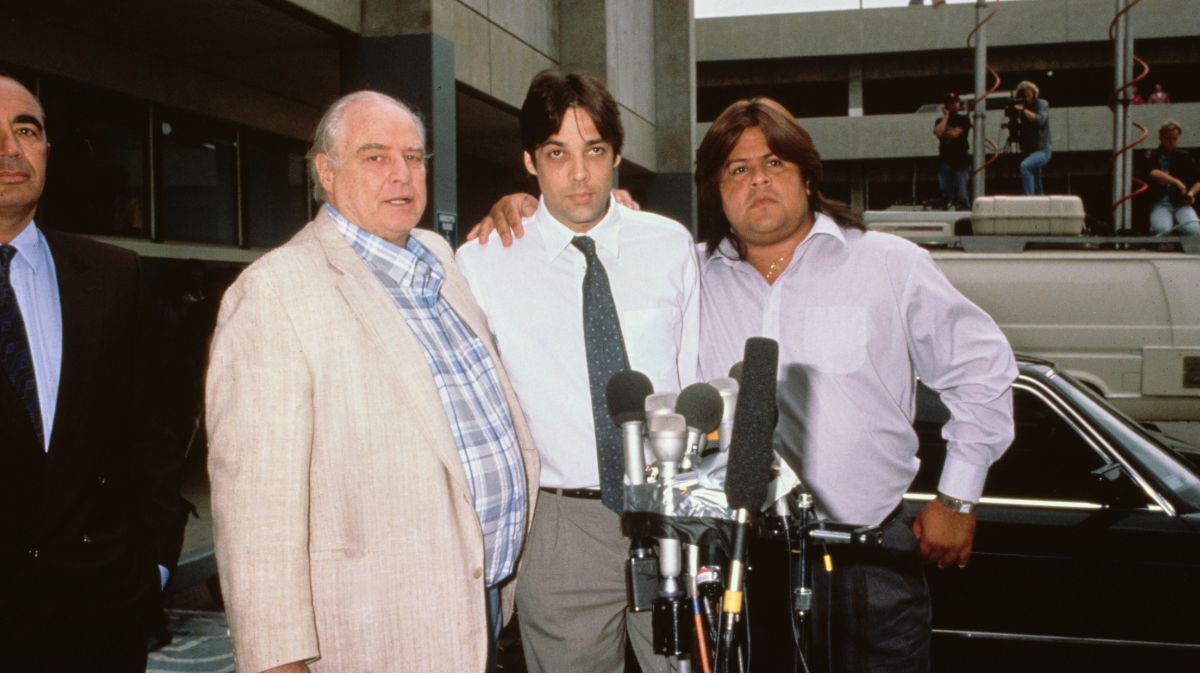 American actor Marlon Brando and his sons, American actor Christian Brando and Miko Brando, address the press at Los Angeles County Jail in Los Angeles, California, 15th August 1990. Christian had fatally shot the boyfriend of his half-sister Cheyenne, Dag Drollet, at his father's residence in the Hollywood Hills. (Photo by Vinnie Zuffante/Getty Images)