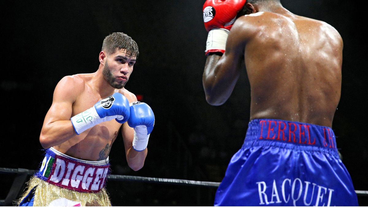 FAIRFAX, VA - OCTOBER 17: Prichard Colon (L) and Terrel Williams exchange punches in their super welterweights bout at EagleBank Arena on the campus of George Mason University on October 17, 2015 in Fairfax, Virginia. (Photo by Patrick Smith/Getty Images)