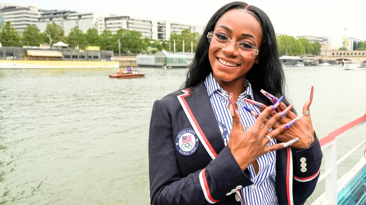 Sha'Carri Richardson poses for a photo while riding with teammates on a boat with teammates along the Seine River during the Opening Ceremony of the Olympic Games Paris 2024 on July 26, 2024 in Paris, France.