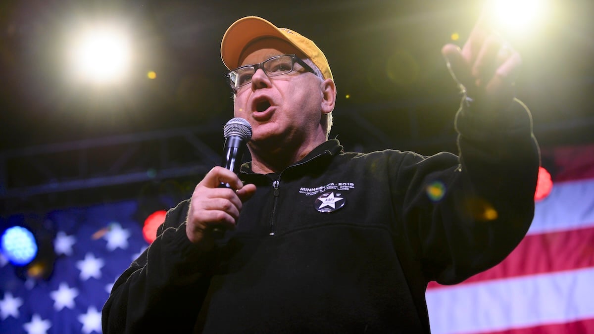 Minnesota Governor Tim Walz introduces Democratic presidential candidate Sen. Amy Klobuchar (D-MN) during a campaign rally