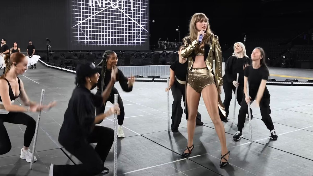 Taylor Swift rehearsing for "I Can Do It With a Broken Heart" with a gold outfit