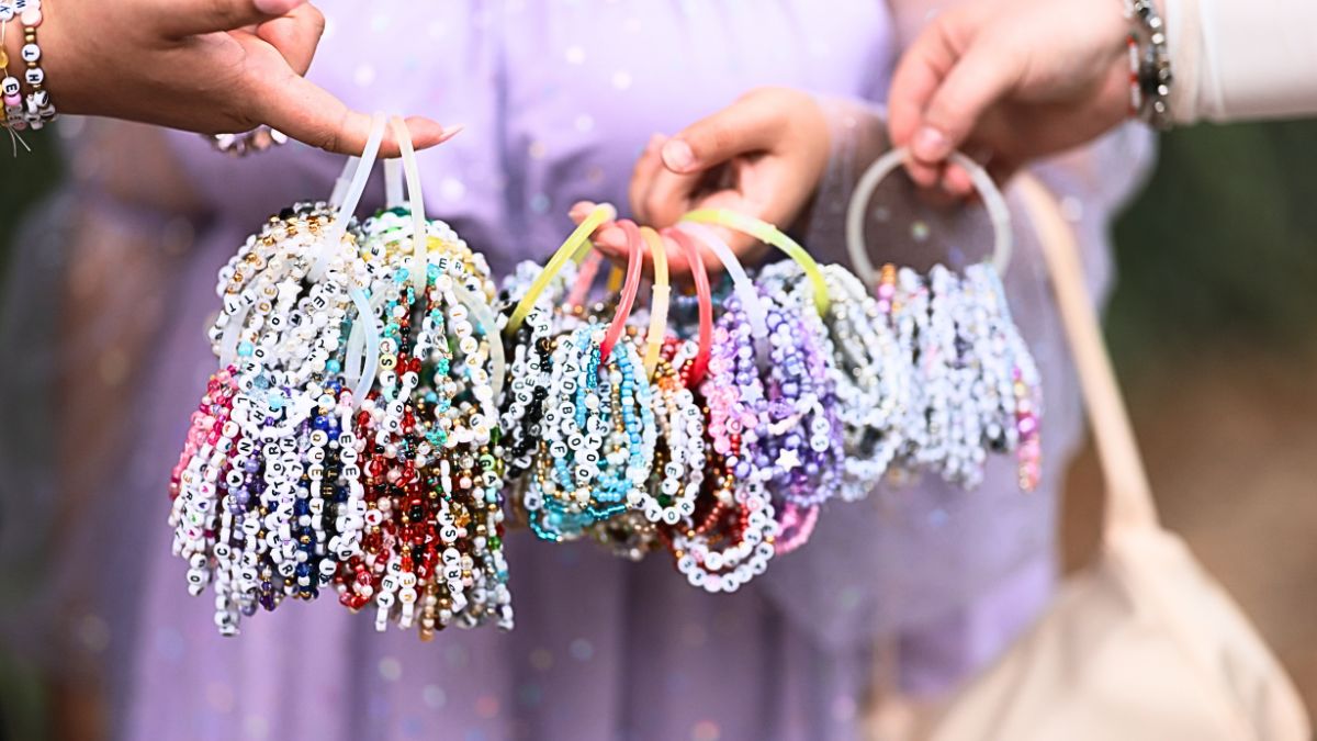 Taylor Swift fans trade friendship bracelets ahead of "The Eras Tour" performances in Hamburg at Volksparkstadion on July 23, 2024 in Hamburg, Germany.